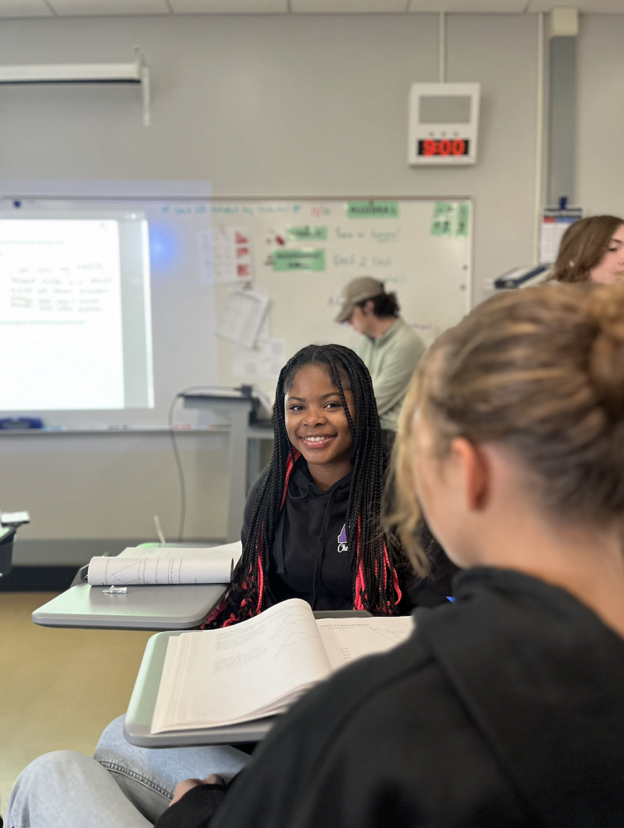 Akaviya Pressley-Dykes sits in her Block 2 Geometry class. In class they worked on scale factor and proofs and got assigned a Delta Math. "I'm just sitting here laughing now." Pressly-Dykes said. "Since we're done learning we can just do whatever we want. Also Ryan's really cool and he's really good at helping when we need it."